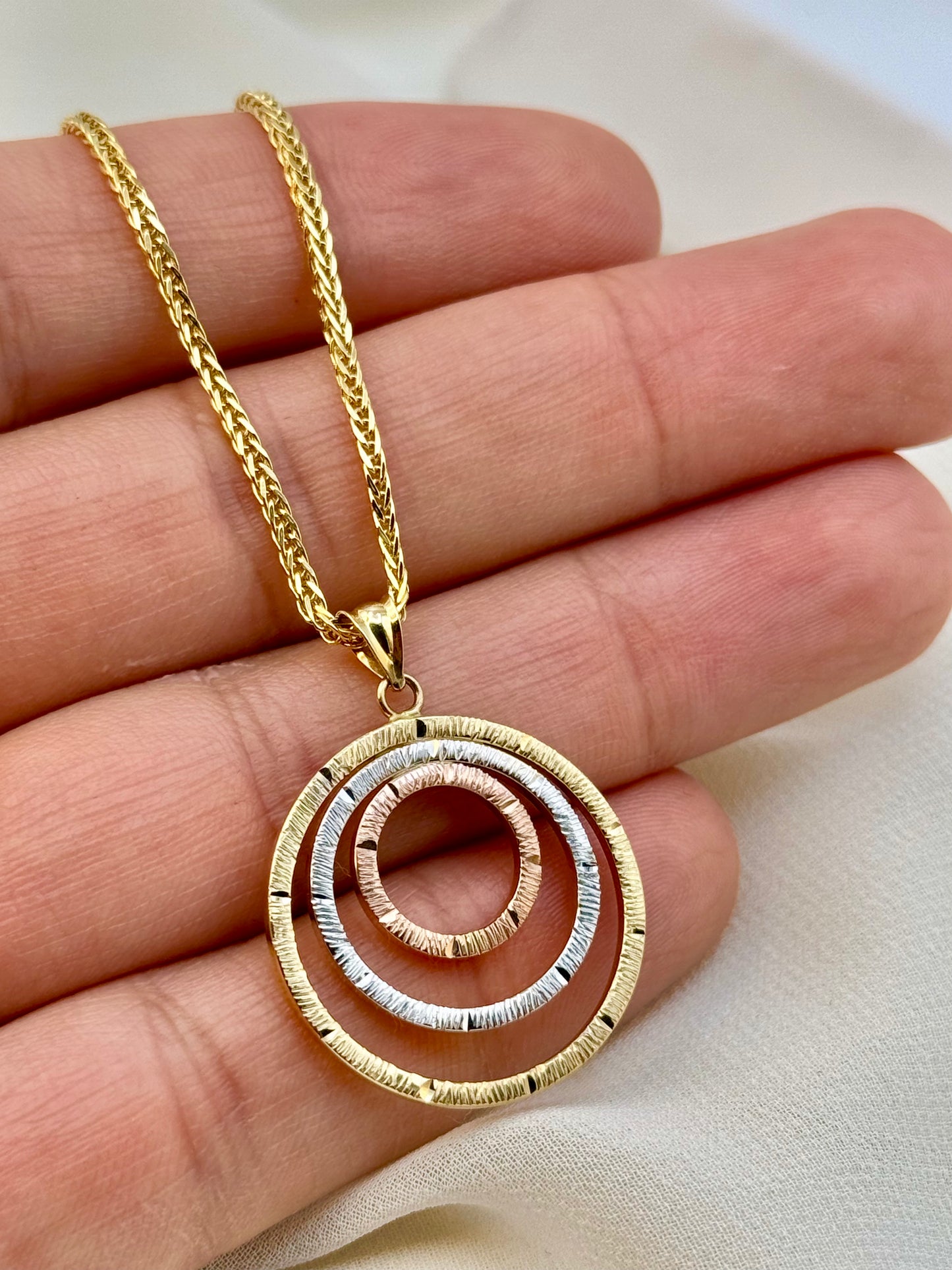 Gold Circle of life on hand
