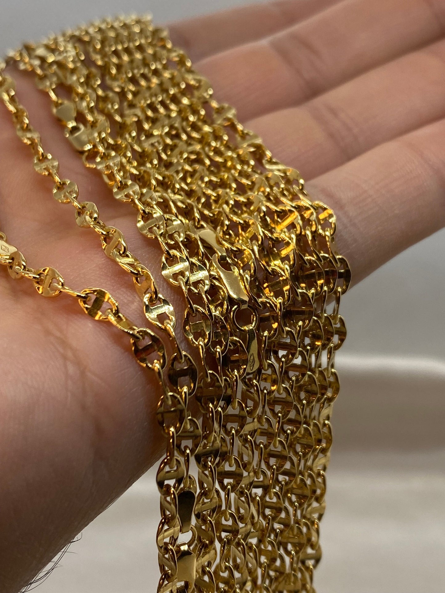 Gold anchor chain.