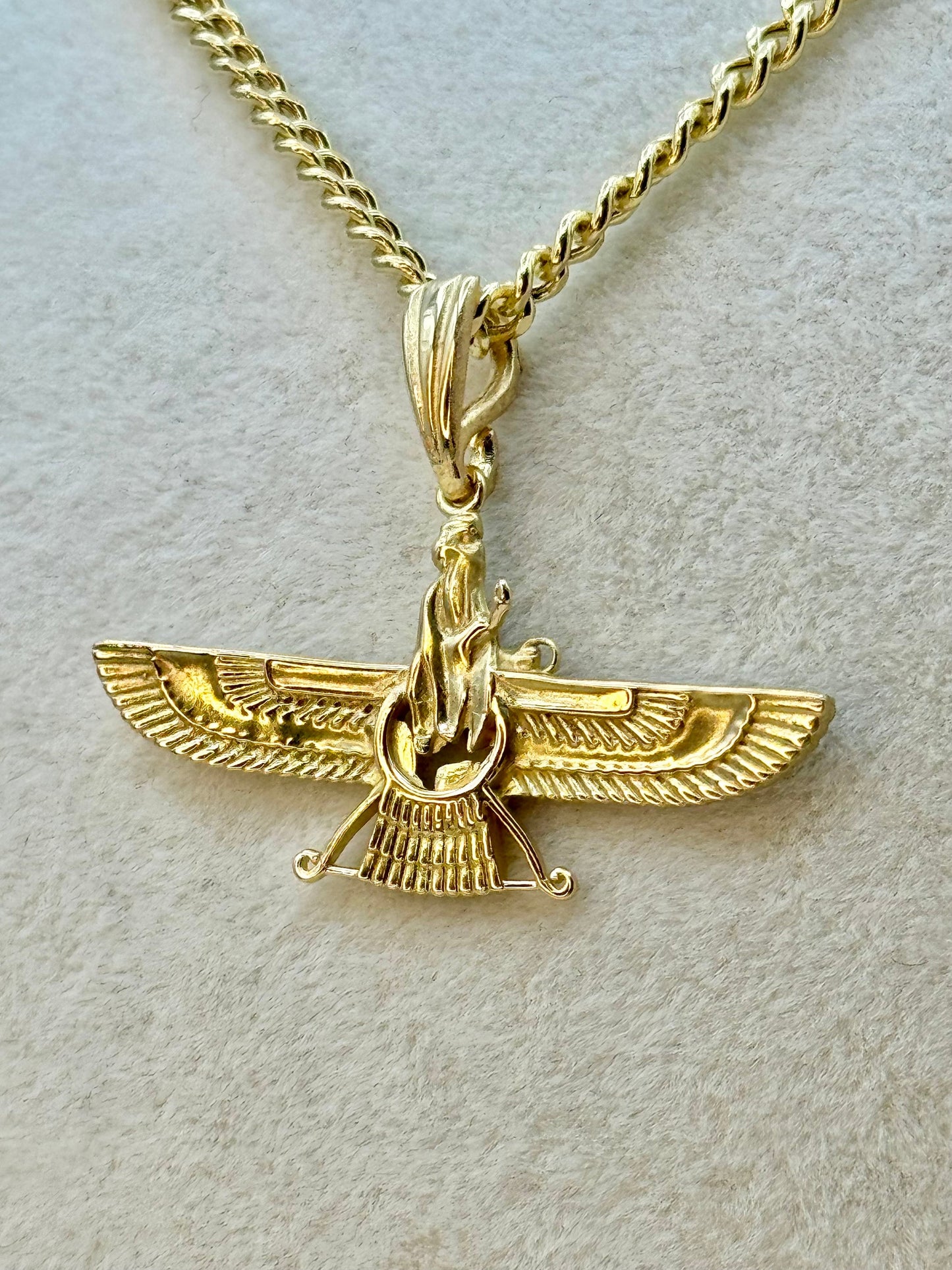 Close up picture showing the details of farvahar pendant
