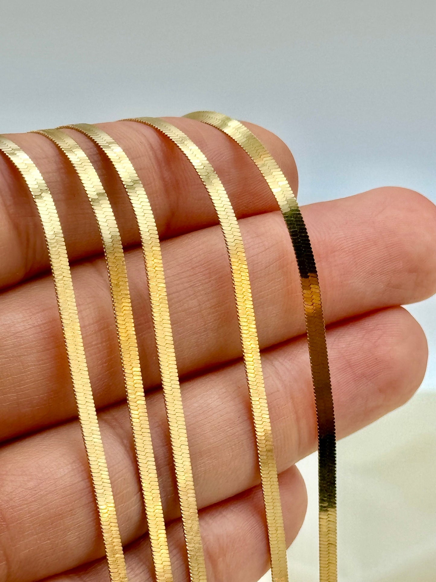solid Gold herringbone on hand