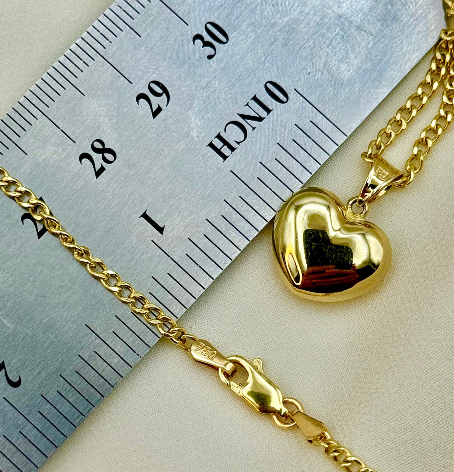Heart Necklace on ruler .