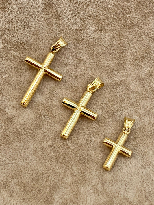 18k Gold Cross pendants on display.
