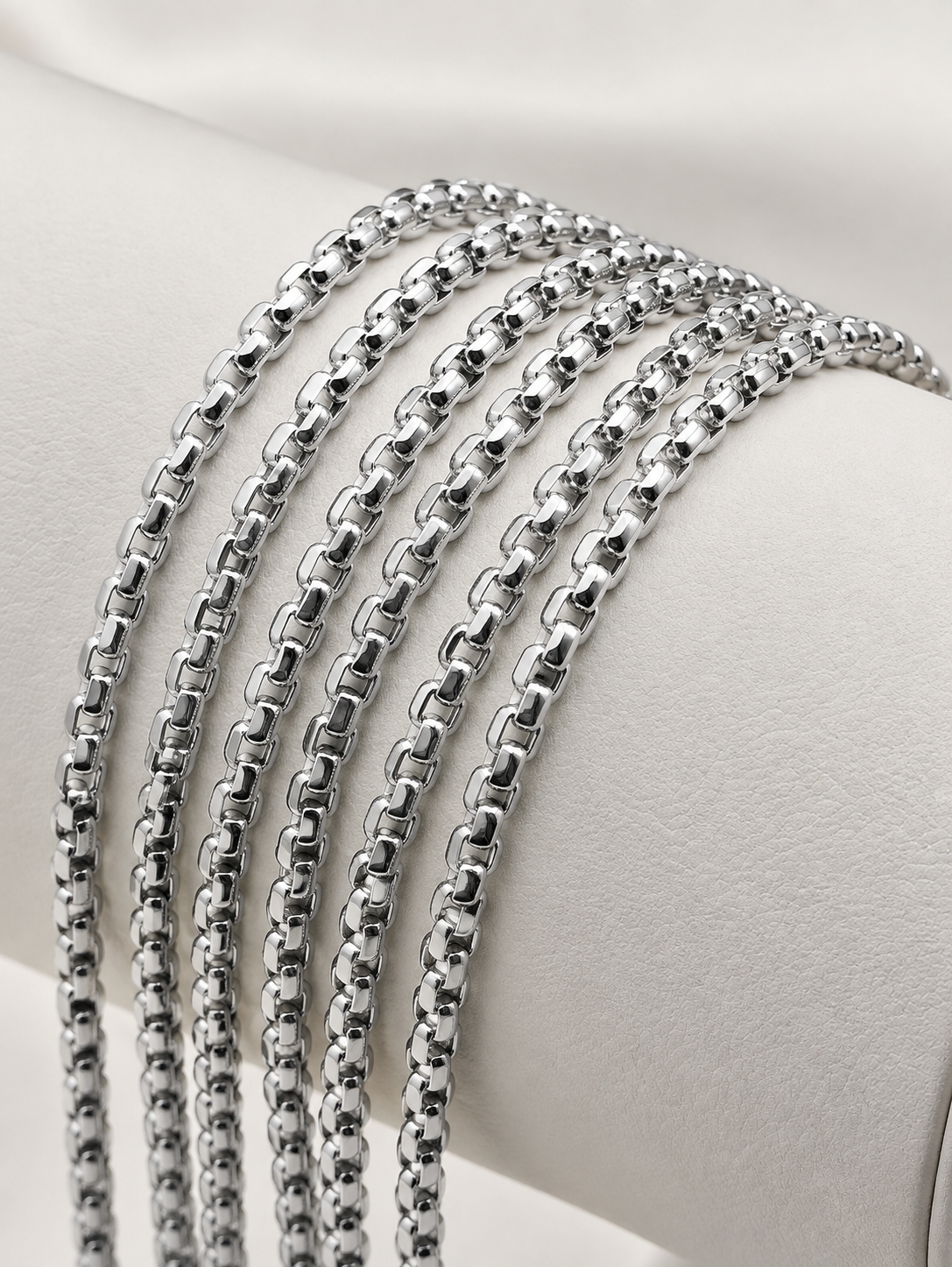 white gold box chain necklace on display.