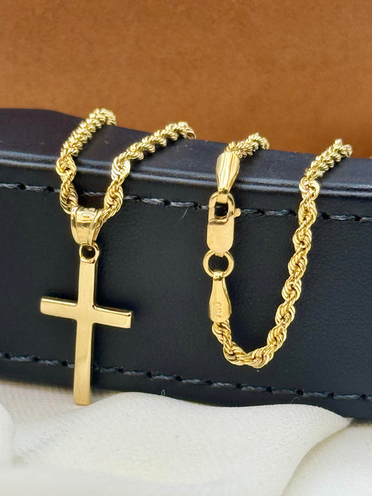 18k Gold plain Cross necklace on a black box