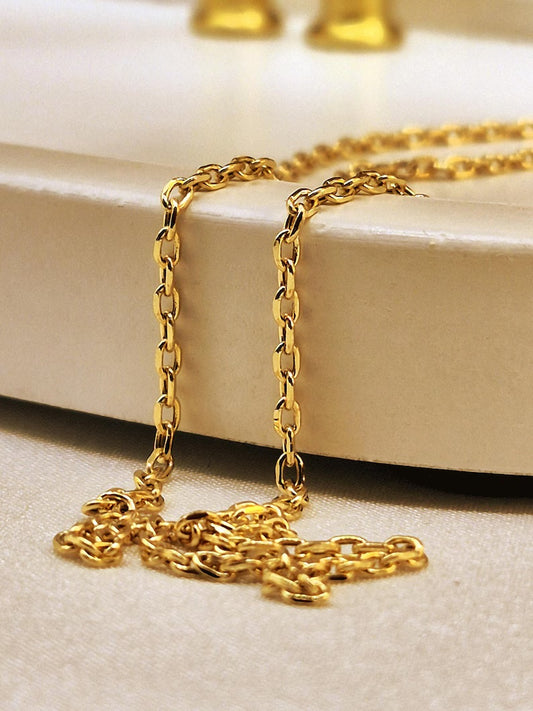 18k Gold cable chain necklace on a white surface