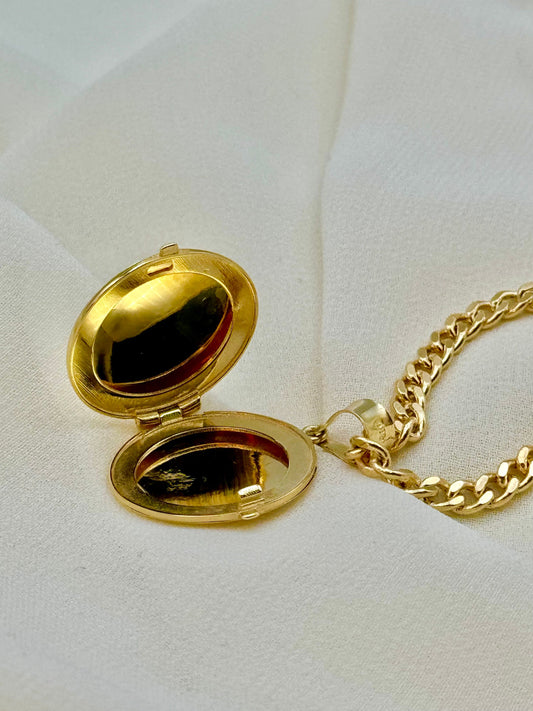 14k Gold round locket necklace .